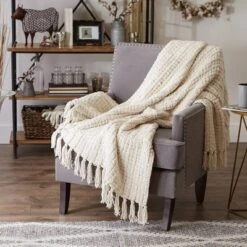 50"x60" Chenille Luxury Tassel Throw Blanket Cream - Design Imports -Design Imports GUEST 943d6d12 ade9 44f0 9204 281917b64069